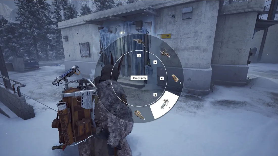 Selecting the Flame Spray from the quick wheel in front of an iced-over door on Pendola Pass