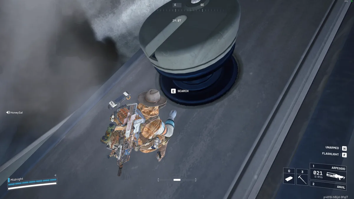 A round loot container on the Frigate's hull with a Search prompt
