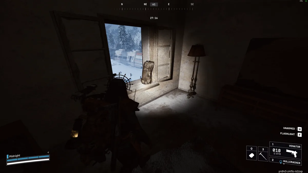 Backpack on the windowsill of a dark house