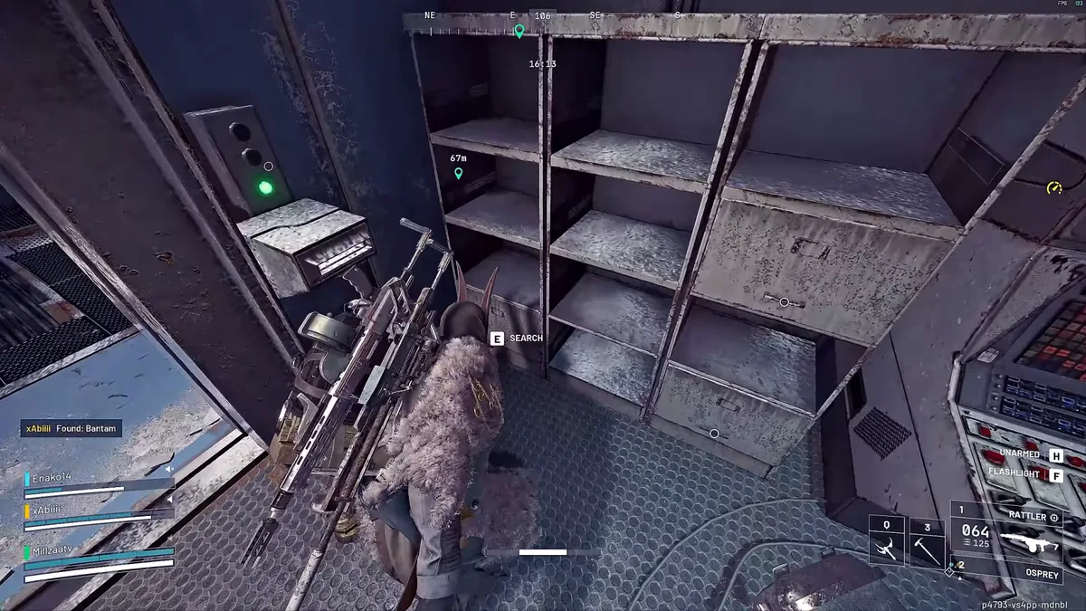 Raider searching the bottom drawer of grey metal shelving next to a control console