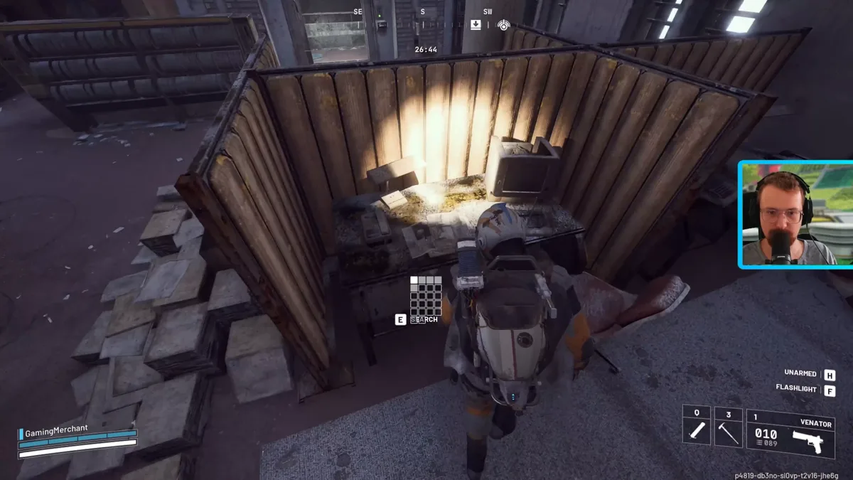Raider searching a cluttered desk in a wooden office cubicle