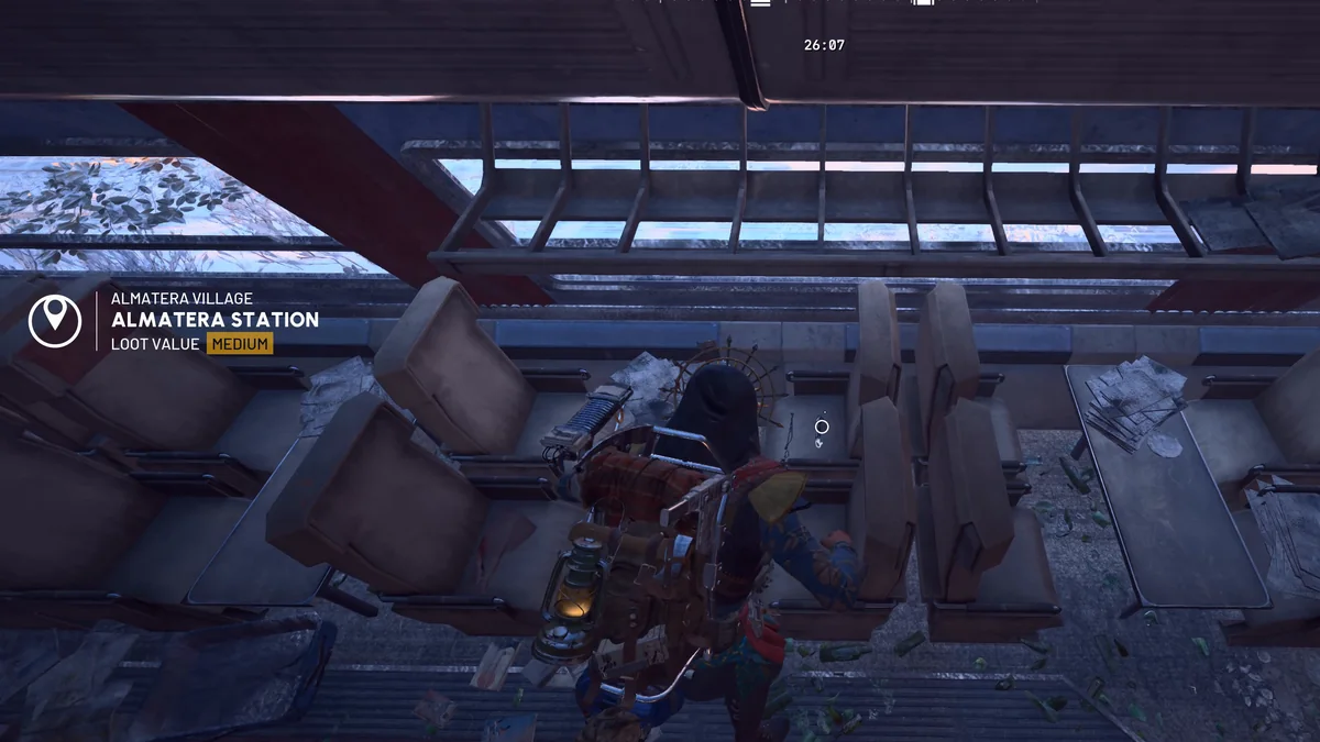 Parked train car under Almatera Station with the area banner showing Loot value Medium