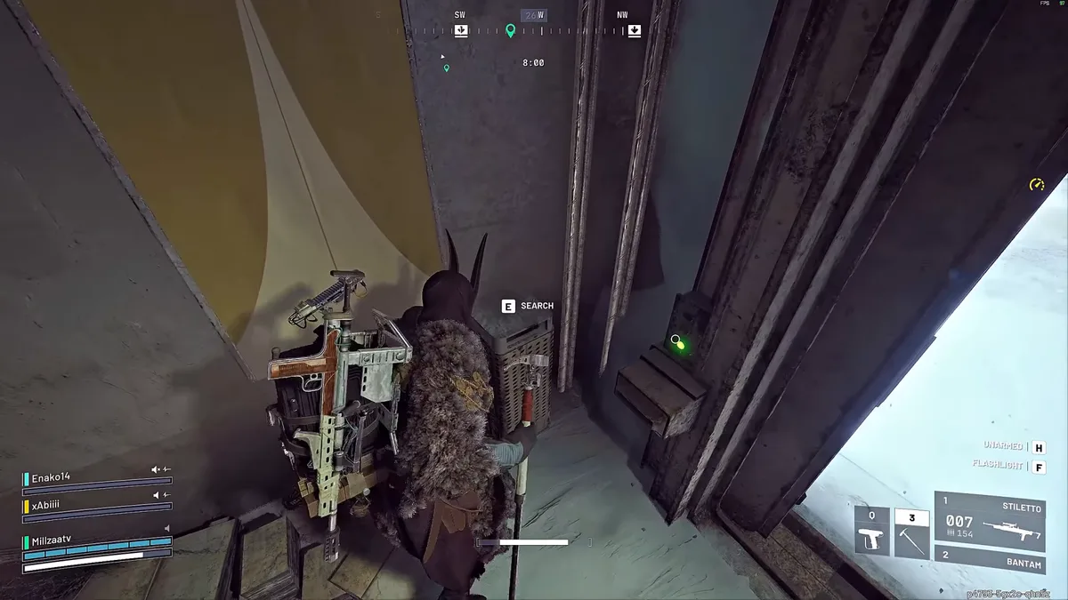 Raider searching a trash can just inside a doorway