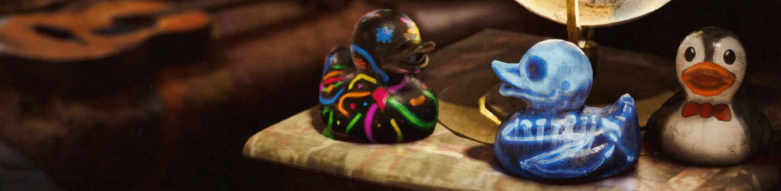 The three community-designed rubber ducks in ARC Raiders: a neon-painted black duck, a translucent blue skeleton duck, and a penguin duck