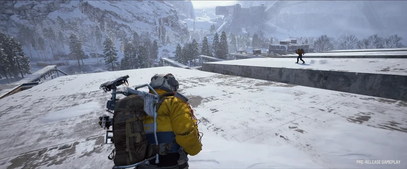 Two Raiders crossing snow-covered rooftops in Pendola Pass with the mountain valley behind